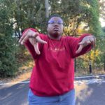 A person in a red shirt
Description automatically generated with medium confidence