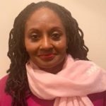 A person wearing a pink scarf
Description automatically generated with medium confidence