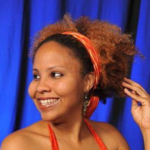 A picture containing person, human face, smile, person
Description automatically generated